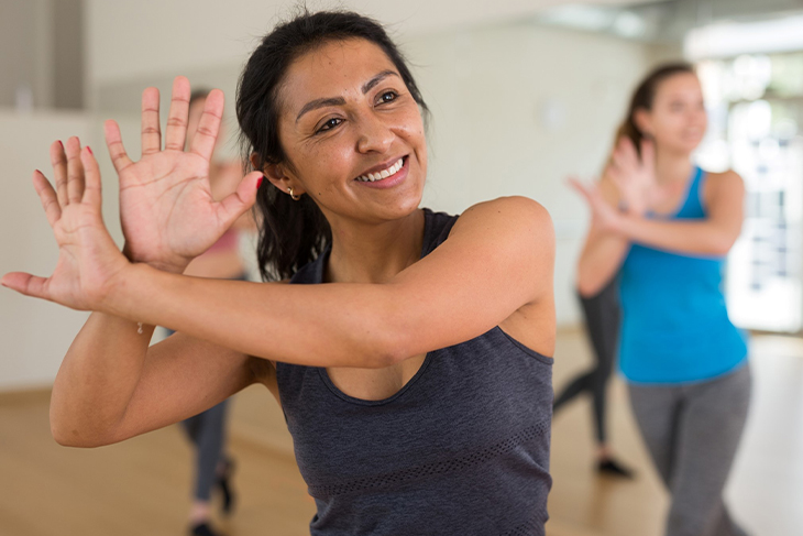 Woman exercising with a group.